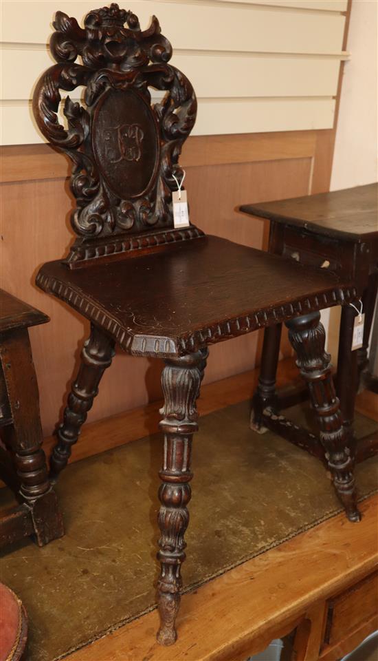 A Victorian carved oak hall chair